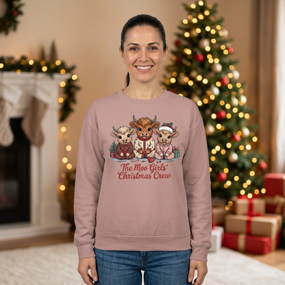 Woman modeling The Moo Girls’ Christmas Crew sweatshirt in Dusty Rose with Christmas tree and gifts